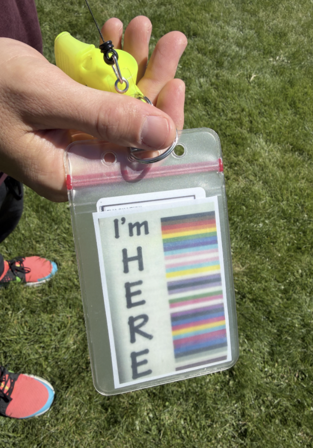 I'm HERE pride-colored staff lanyard badge