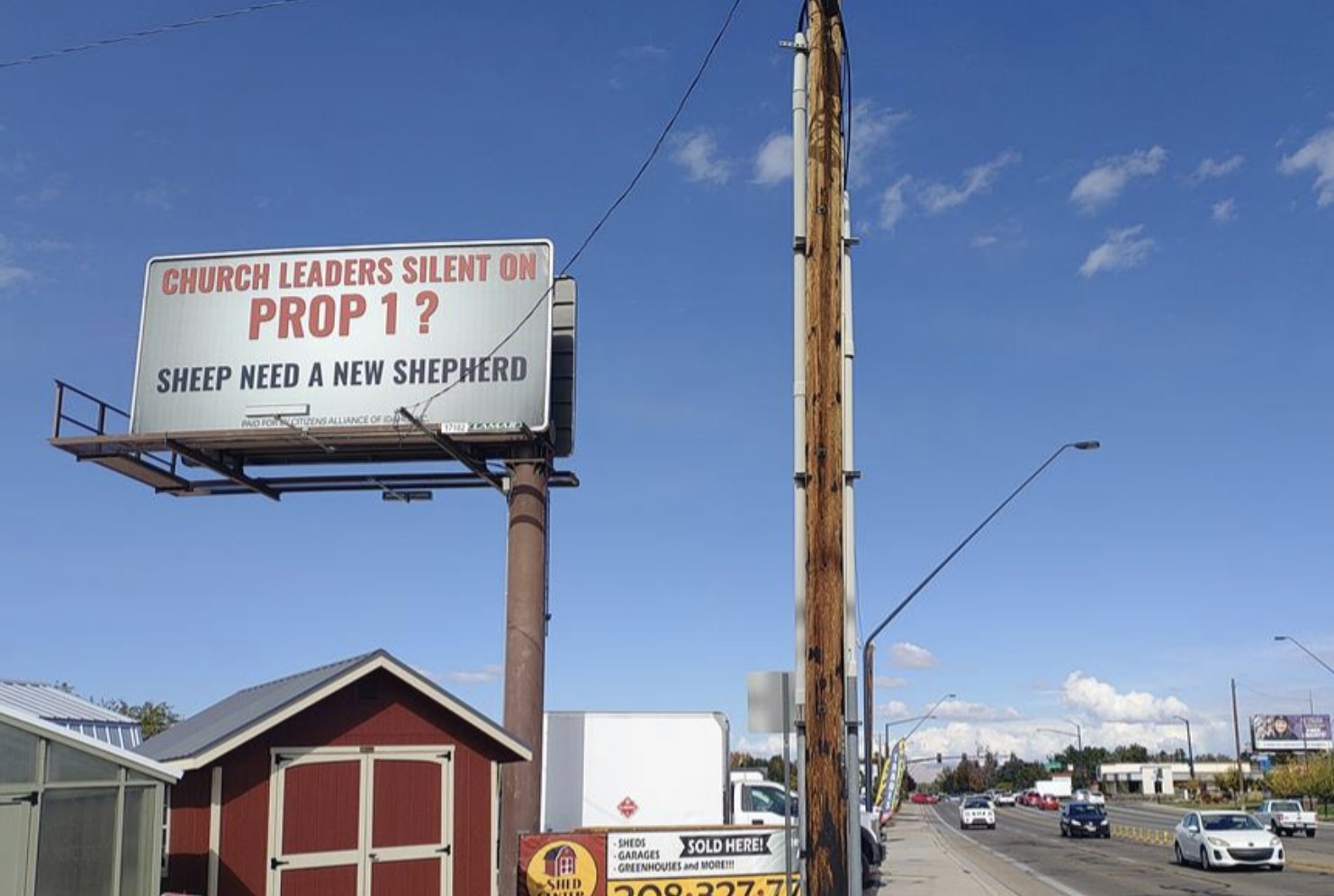 A roadside billboard reading Church Leaders Silent on Prop 1? Sheep Need a New Shepherd, paid for by Citizens Alliance of Idaho